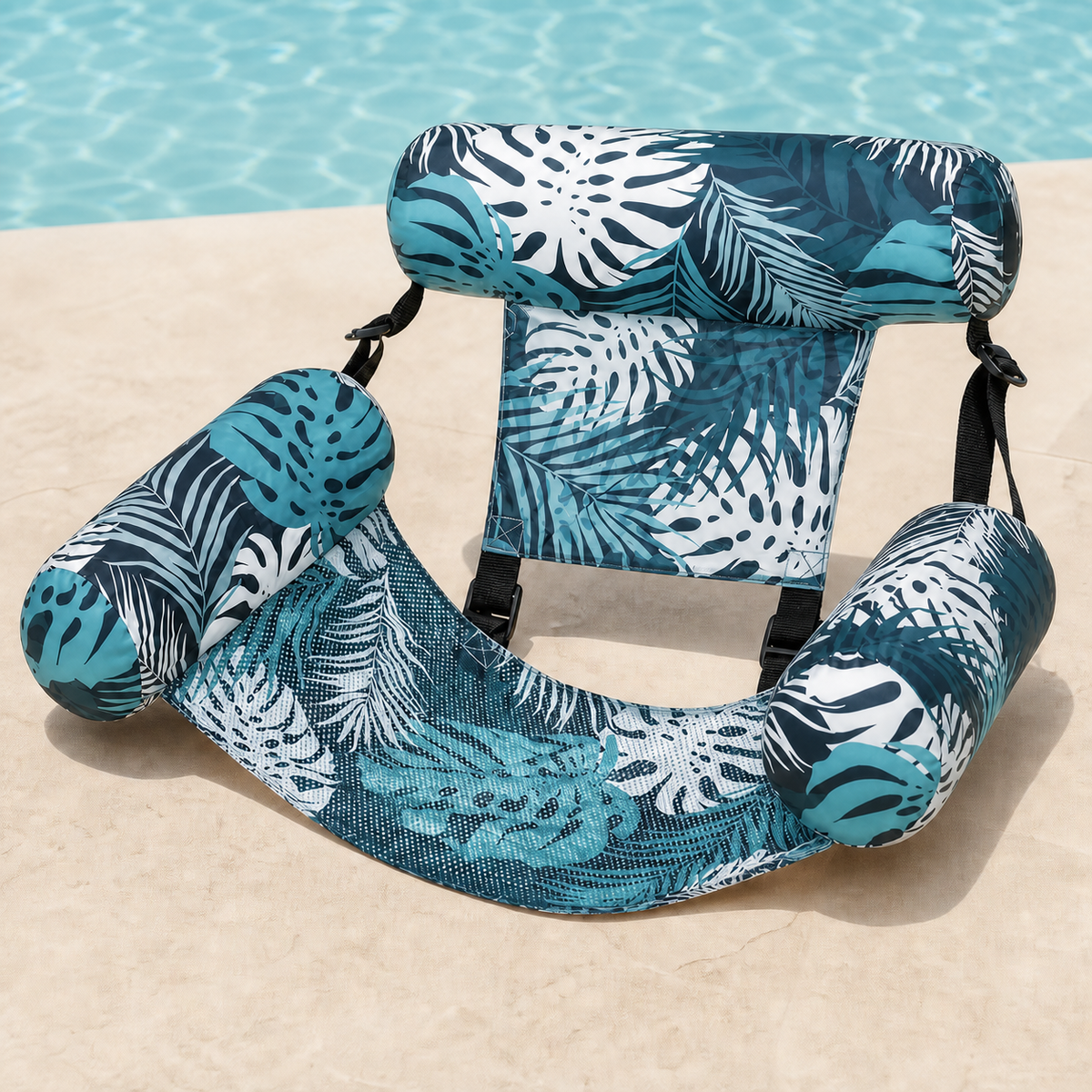 Poolora Float Chair in Fresh Aqua tropical leaf print beside a swimming pool